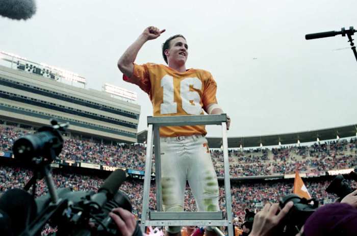 Tennessee quarterback and "maestro" Peyton Manning leads the Vols' Pride of the Southland Band in a rendition of "Rocky Top" after the No. 3 ranked Volunteers closed out Vanderbilt 17-10 at Neyland Stadium in Knoxville on Nov. 29, 1997.